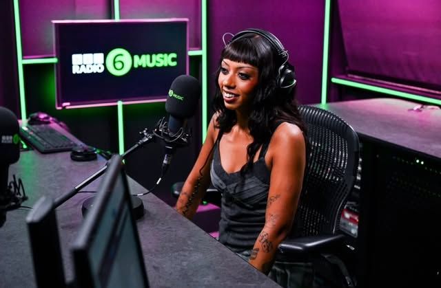Nia Archives at the microphone in the BBC Radio 6 Music studio