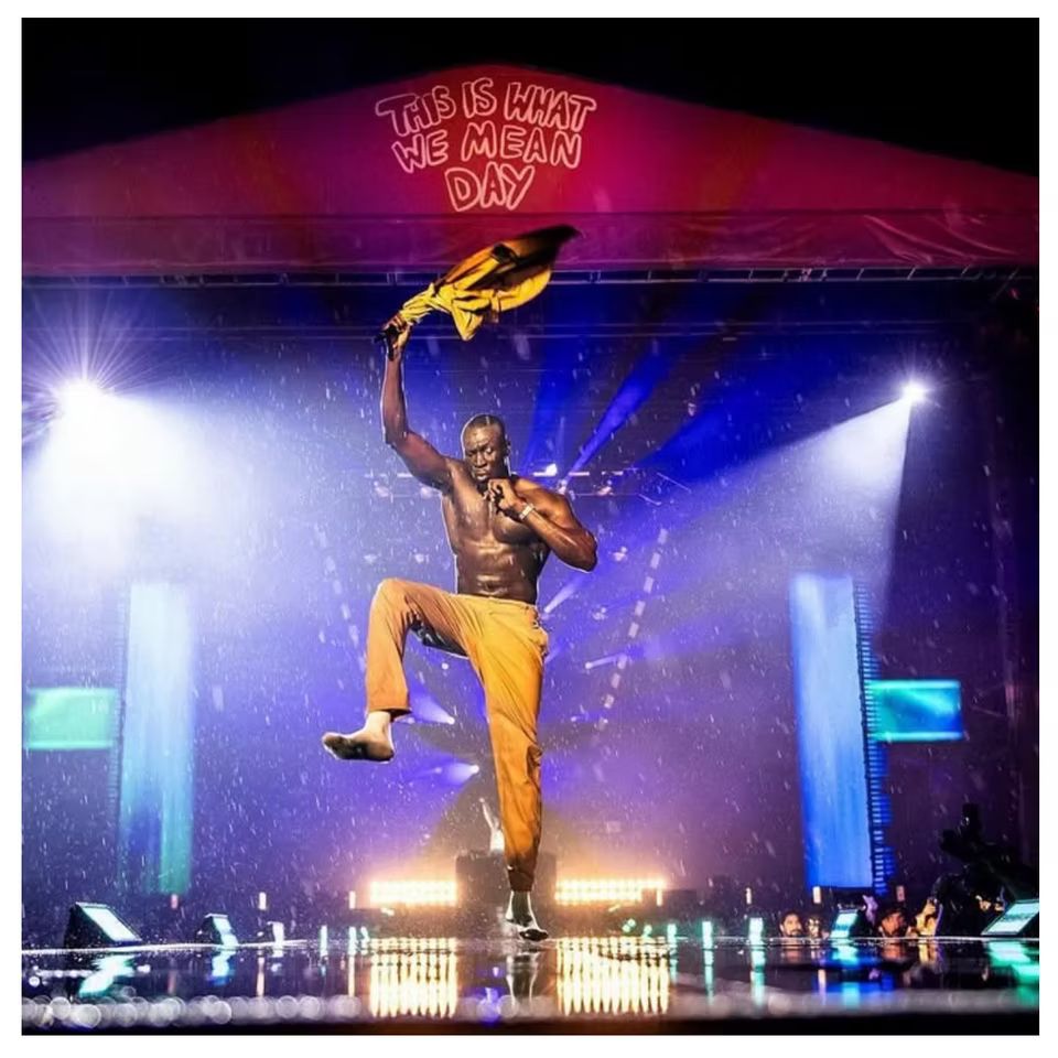 A live music performance in front of a festival audience