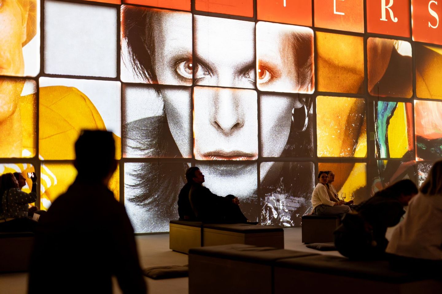 David Bowie’s face projected above visitors at The Lightroom’s You’re Not Alone exhibition